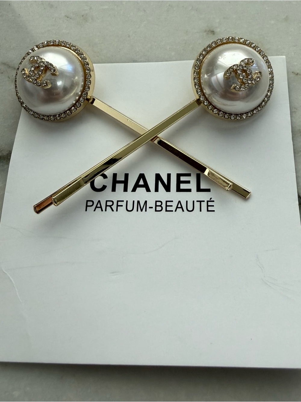 Chanel Beaute pearly white and crystal hair clips